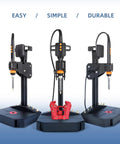 Vertical heat-set insert tool press with 90W soldering iron; three stations on bases with orange controls and a red 3D-printed part.