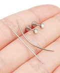 F136 Titanium Threadless Opal Flat Back Stud Earrings For Women, 20G 6mm Bar, Medical Grade Titanium shown on hand with tool