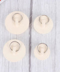 4pcs Rubber Sink Stopper Plug with Hanging Ring for Bathtub Drains, showing two sizes with metal rings on a light wood background.