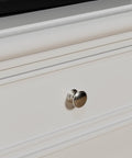 Close-up of 25 Pack Brushed Nickel Round Cabinet Knobs And Drawer Pulls For Kitchen Cabinets And Dressers installed on white drawer.