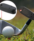 Premium Golf Putter Laser Pointer Putting Trainer Aim Line Corrector on golf club aiming at a golf ball on grass.