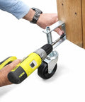 Installing Heavy Duty 4 Inch Spring Loaded Gate Caster Wheel with drill on wooden gate for automatic height adjustment.