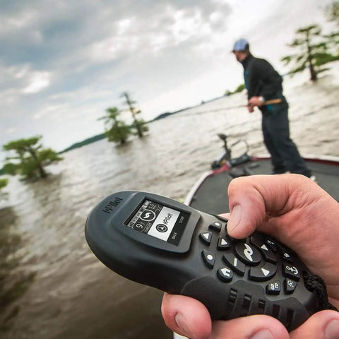 Rock Solid Replacement Remote For Trolling Motor With Slick Ergonomic Grip And Large LCD Screen waterproof controller in hand on boat.