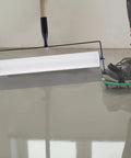 Pro Grade Self Leveling Concrete Tool Kit For Smooth Cement Floors With Spike Shoes And Roller Needle 13mm Durable PE Roller in use
