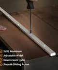 Person using a screwdriver on Heavy Duty T Slot Miter Bar Three Quarters By Eighths By Thirty Six Inches With Screw Kit for woodworking.