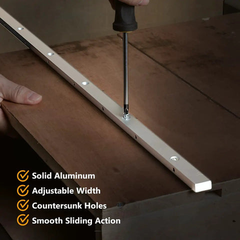 Person using a screwdriver on Heavy Duty T Slot Miter Bar Three Quarters By Eighths By Thirty Six Inches With Screw Kit for woodworking.