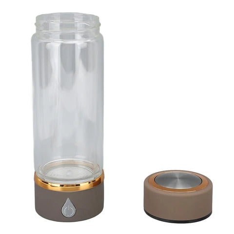 Keep It Fresh And Locked In With This Portable Hydrogen Water Bottle Featuring USB Rechargeable Tech And Stainless Steel Build For Antioxidant Rich Hydration At The Gym Or Office All Day Long - clear glass bottle and base.
