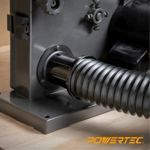 Flexible Dust Collection Hose Kit Two And One Quarter Inch Diameter attached to woodworking dust collector machine.