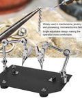 Pro Grade Sturdy Welding Table Clamp with 360 Degree Adjustable Arms, shown on workbench, for soldering and repairing tasks.