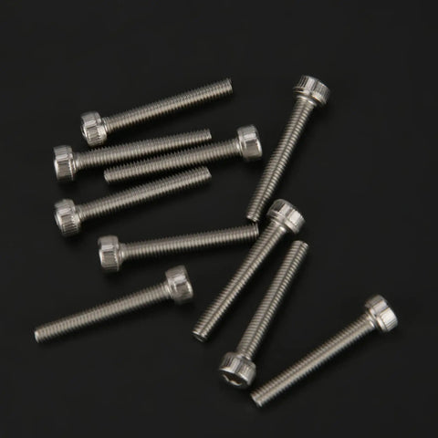 135-Piece Metric Screw Assortment Kit With Button Head Socket Cap Bolts In 304 Stainless Steel, scattered on black surface