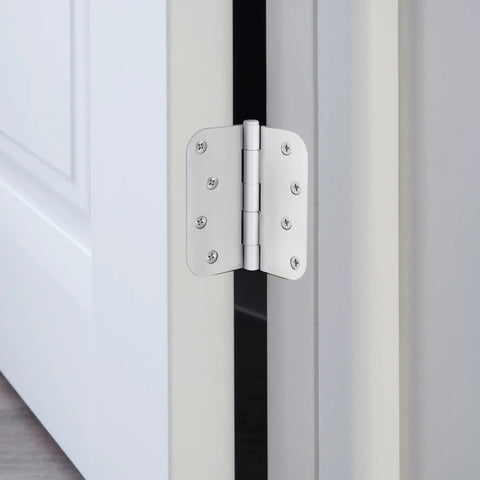 Heavy Duty 4 Inch Interior Door Hinges White Steel 3 Pack Smooth Swinging Removable Pin installed on a door frame