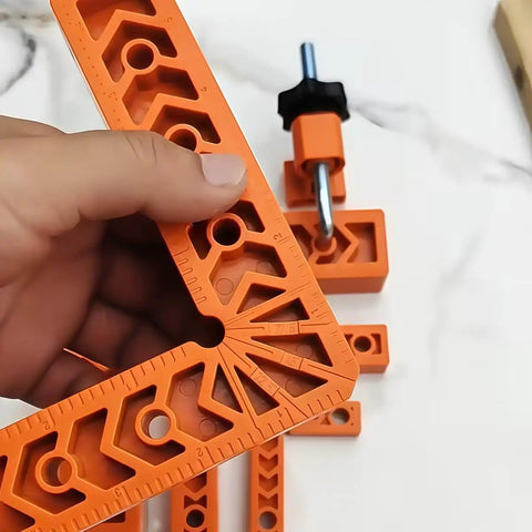 Killer Adjustable Seven Piece Right Angle Clamp Set Lightweight ABS Plastic Corner Clamping Kit for Smooth Woodworking in orange.