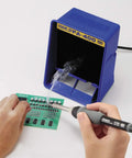 Person using Lightweight Soldering Iron With T18-B Tip For Electronics, 26V 65W Ceramic Heater on PCB with smoke absorber