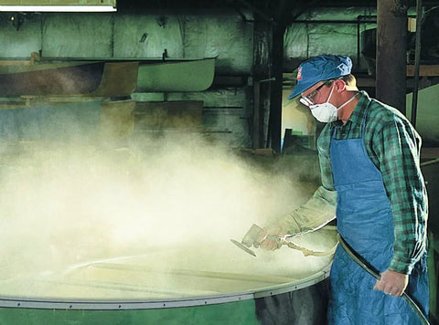 Worker wearing N95 Particulate Respirator With Adjustable Nose Clip And Two Strap Design Lightweight Disposable Mask during dust work