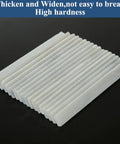 54 Piece Soapstone Pencil Set White Flat Tipped Marking Pencils For Welding And Textile Projects stacked on black surface
