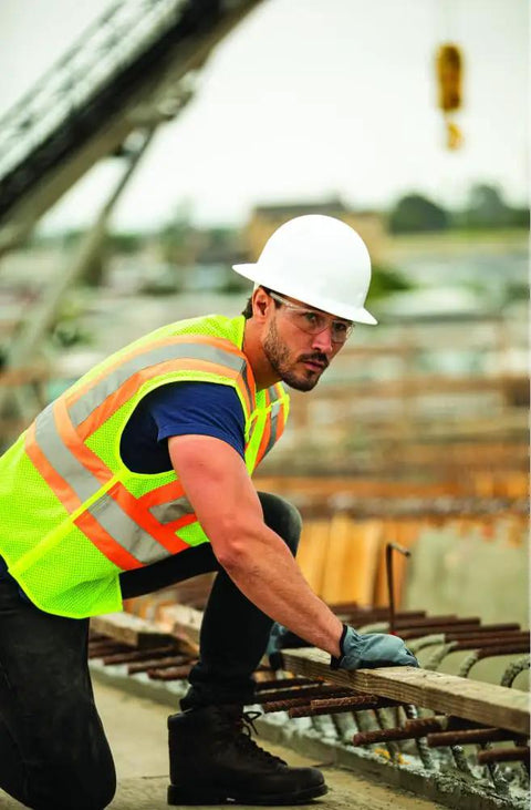 Men's High Vis Reflective Breakaway Safety Vest With Contrast Mesh And Quick Hook Closure Ansi Class Two Jobsite Ready Traffic Control Utility Gear Lime Orange Trim Real Big Size Built Tough on a worker in a safety helmet.