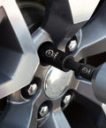 One Half Inch Drive Deep Impact Socket Set, 20 Piece CR V Steel Metric Sockets 10mm Through 24mm in use on car wheel