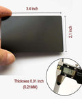 Person holding Fifty Pcs Matte Black Metal Business Card Blanks For Laser Engraving, showing size 86 x 54 mm, 0.21 mm thickness.
