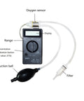 Portable Oxygen Concentration Tester for Industrial and Mining Jobsites with suction ball and calibration button.