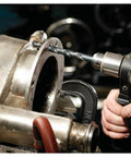 Bosch 1/4 in x 12 in extra-length black oxide drill bit in a handheld drill drilling into a metal flange.