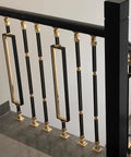 Solid Heavy Duty Adjustable Black Square Aluminum Deck Balusters And Stair Railing Spindles, 8 Pack with gold accents on stairs.