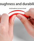 36 Pcs Cycling Reflectors In Red Yellow And Blue For Your Night Rides showing toughness as hands bend a red reflector