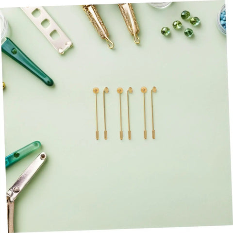Bulk 50 Pack Copper Flat Round Tray Lapel Pins With Heavy Fabric Fastening And Raw Finish Metal Brooch Sticks For Industrial Crafts And Costume Accessories on mint green background.
