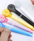 Smooth As Butter Pen Style Correction Tape Rollers With Zero Stink And Zero Drama Glide For Fast Edits Portable Mini White Out Erasers in assorted colors.