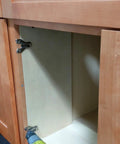 Installation of Full Overlay Cup Hinge Soft Close For Face Frame Cabinets on wooden cabinet door, using a drill tool.