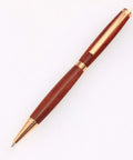 Premium Slimline Pen Turning Kit With 10 Pack Assorted Fly Metallic Finishes Including Gold Black Chrome Gun Metal And Copper Plus Cross Style Refills For Crafting Dope Custom 7mm Ballpoint Pens showing a wooden ballpoint pen with gold accents.