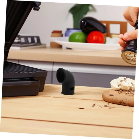 Black silicone diverter hose for pressure cookers on wooden kitchen counter, demonstrating use and size
