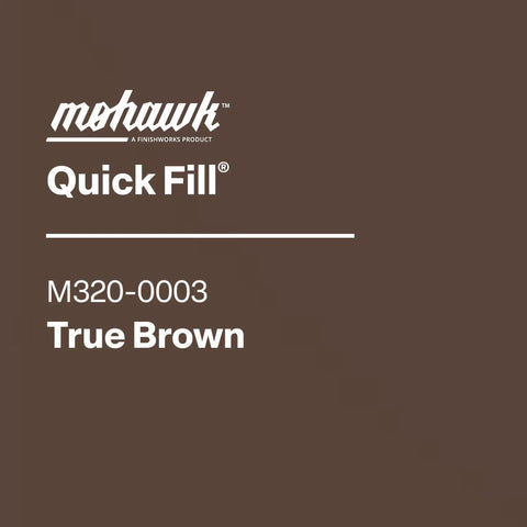 Quick Fill Burn In Stick Wood Filler In True Brown Shade for patching scratches on wood surfaces and furniture.
