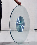 Person holding 30 Inch Kitchen Tabletop Lazy Susan Turntable With Tempered Glass 360 Degree Swivel Serving Tray Aluminum Base.