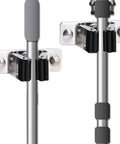 Heavy Duty Stainless Steel Mop And Broom Holder Wall Mount 2 Pack showing two holders with mounted mop and broom.