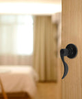 Quiet Operation Matte Black Door Lever Handle With Silent Technology And Wave Style Privacy Lock in bedroom setting