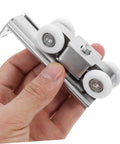 Close-up of Stainless Steel Sliding Door Pulley Wheel Kit Heavy Duty Roller for Closet and Patio Doors in hand
