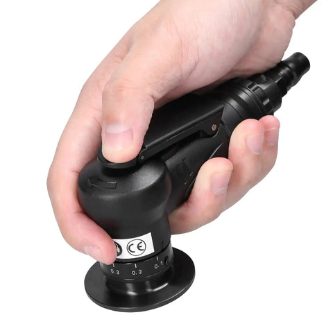 Hand gripping a Heavy Duty Pneumatic Chamfering Machine Portable Angle Grinder Tool for precise deburring of materials.