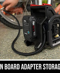 12V Digital Tire Inflator With Real Time Psi Gauge And Auto Shutoff shown with onboard adapter storage and hose connection.