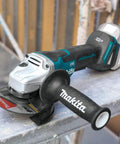 18V LXT Brushless Cordless Paddle Switch Cutoff And Angle Grinder Four And One Half Inch To Five Inch Electric Brake on metal