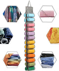 Top Tier Hanging Closet Organizer With Twenty Six Pockets For Leggings And Tees Plus Double Sided Oxford Fabric Rack showcasing rolled garments.