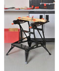 Portable Work Bench With Vise And Adjustable Height Legs, heavy duty steel frame, in workshop setting with tools on top.