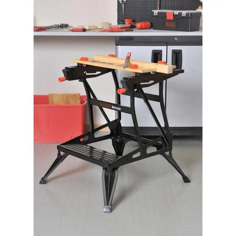 Portable Work Bench With Vise And Adjustable Height Legs, heavy duty steel frame, in workshop setting with tools on top.