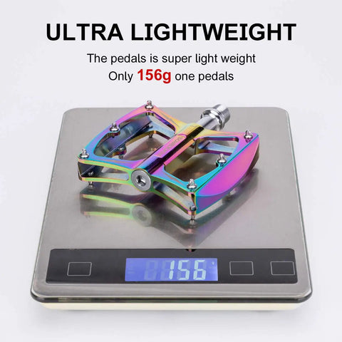 Nine Sixteenths Inch Aluminum Mountain Bike Pedals With Sealed Bearings on scale showing 156g weight