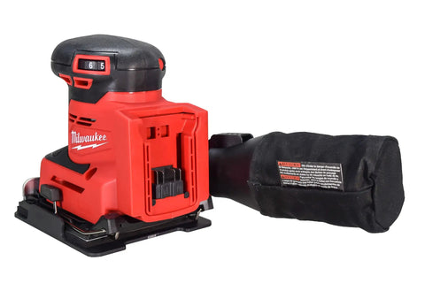 Cordless Eighteen Volt Quarter Sheet Finish Sander With Pro Grade Dust Collector and variable speed dial, showing ergonomic design and dust bag.