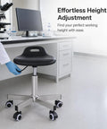 Heavy Duty Swivel Stool With Rock Solid Metal Build And Smooth Rolling Wheels For Studio Or Cleanroom Use showing height adjustment feature.