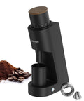 Heavy Duty Single Dose Coffee Grinder With Six Conical Burrs And Stepless Dial Delivers Hella Fine Ground Beans For Espresso Drip French Press Or Cold Brew Keeps Rock Solid Fresh, showing black grinder and ground coffee.