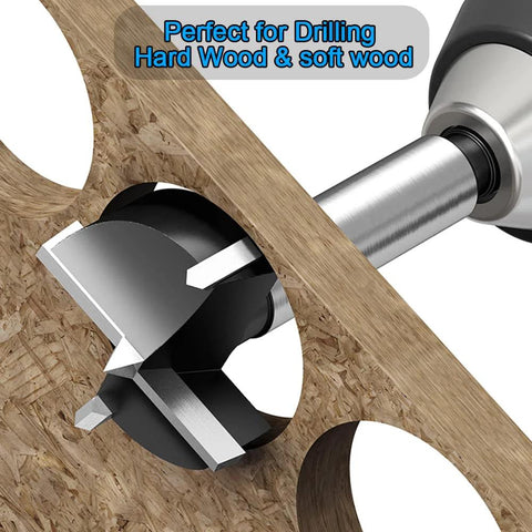 Front view of a carbide-tipped 3-inch Forstner drill bit cutting a hole in plywood.