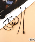 20 Pcs Black Stainless Steel Wire Keychains 1.5mm Thick Elastic Wire Rope Loops 5.9 Inches Long on a beige surface