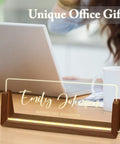 Personalized Acrylic Desk Name Plate With Light Up Base on desk, reads 'Emily Johnson Marketing Manager', unique desk sign.