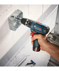 12V Max 3/8 Inch Hammer Drill Driver Bare Tool For Pros being used on a wall, demonstrating compact and handy design.